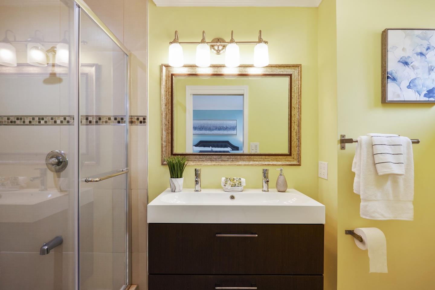 492 Dolores Drive Milpitas, CA 95035 - Photo 33 of 50 a bathroom with a sink vanity and a mirror