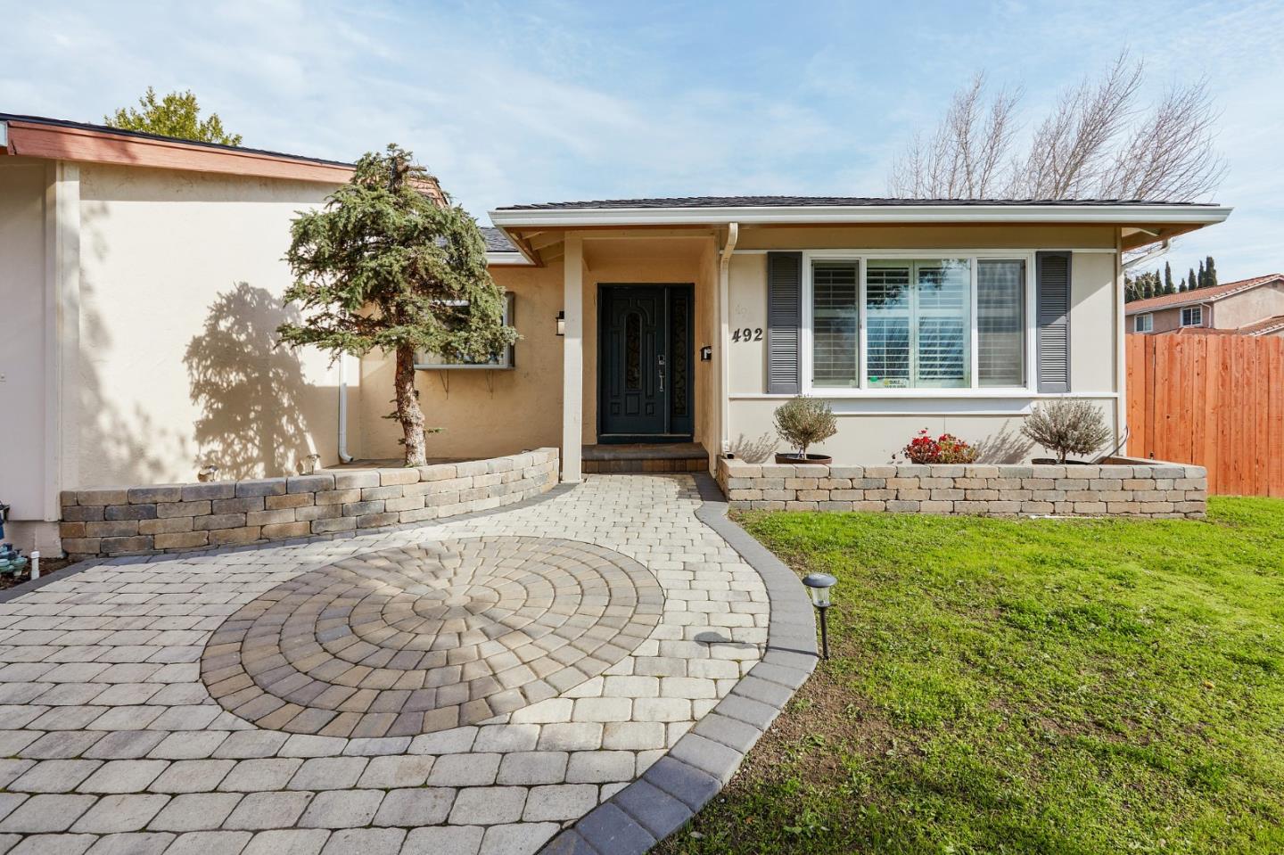 492 Dolores Drive Milpitas, CA 95035 - Photo 5 of 50 a front view of a house with garden
