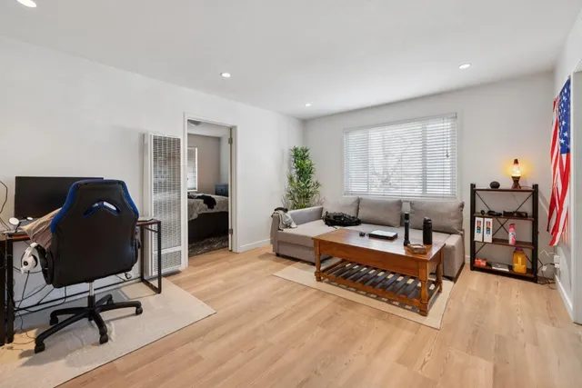 a living room with furniture or couch and a flat screen tv