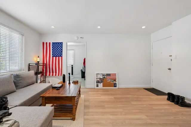 a kitchen with stainless steel appliances granite countertop a refrigerator sink and stove