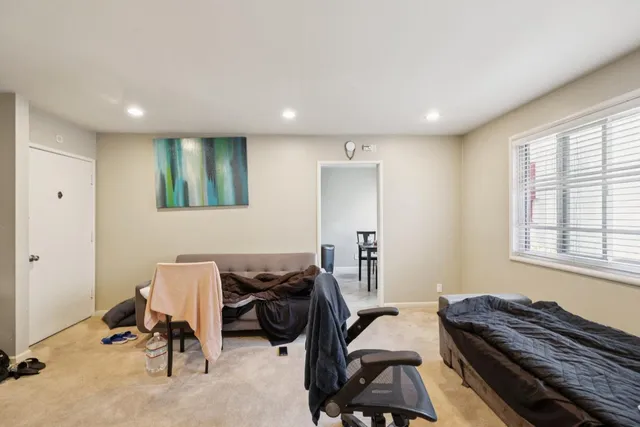 a view of a workspace with furniture and windows