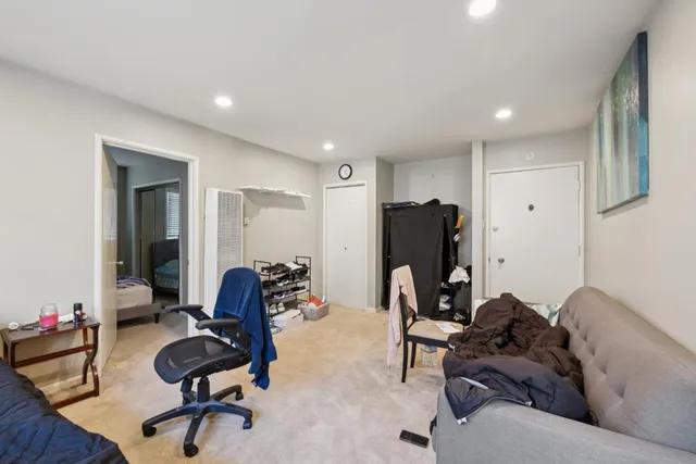 a bedroom with furniture and a window