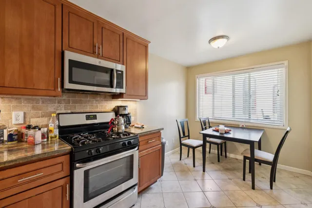 a dining room with furniture and window
