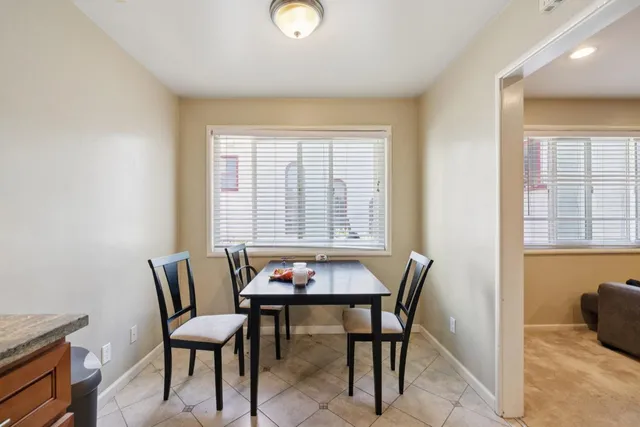 a kitchen with refrigerator and cabinets