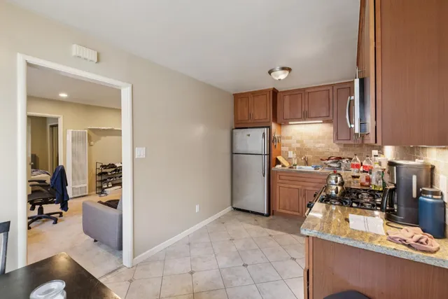 a view of a livingroom with a flesh screen and a window