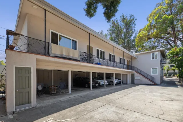 a view of a building with sitting area