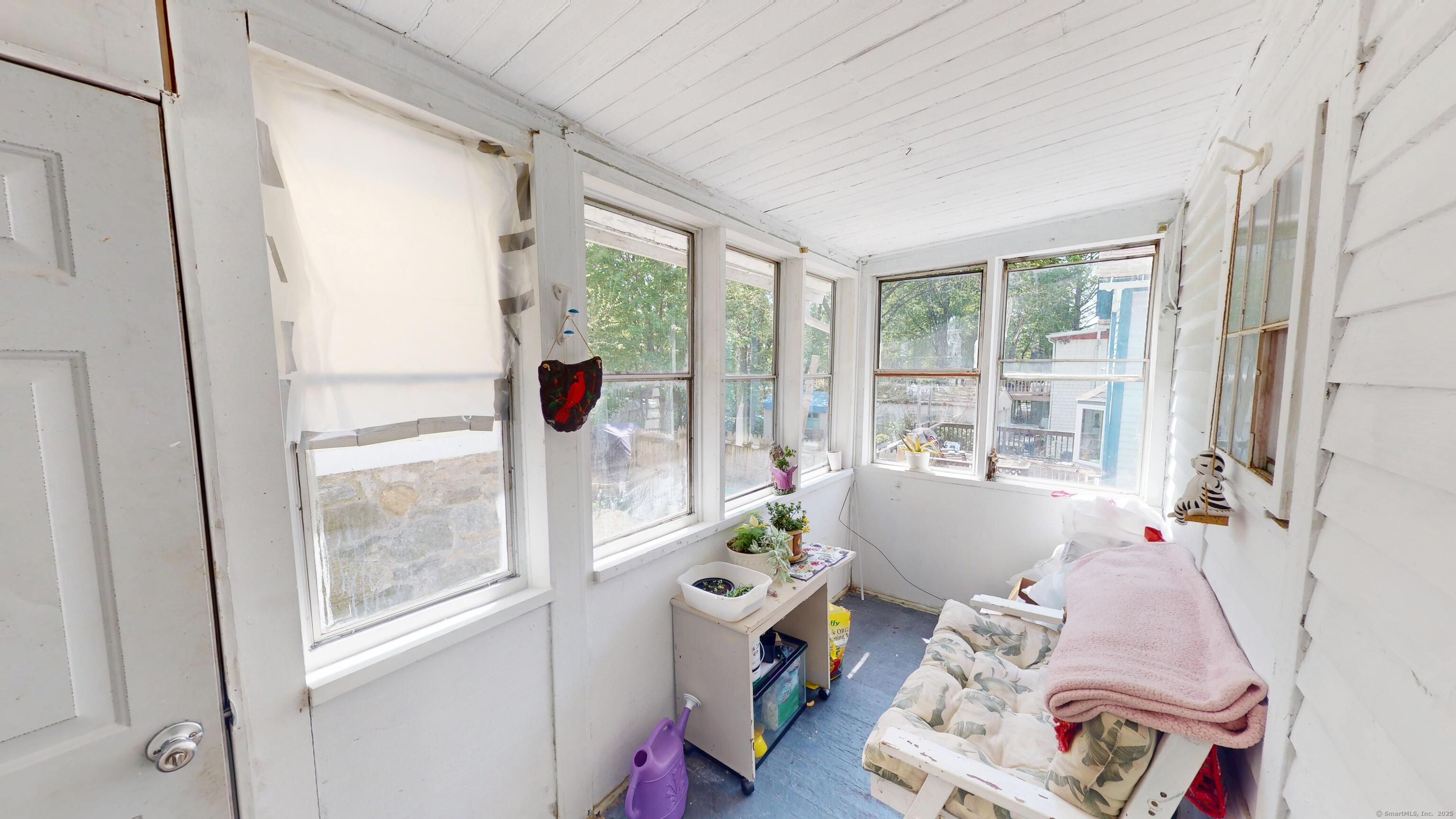 129 Walnut Street Windham, CT 06226 - Photo 12 of 19 Cozy seasonal room leading out to the back yard.