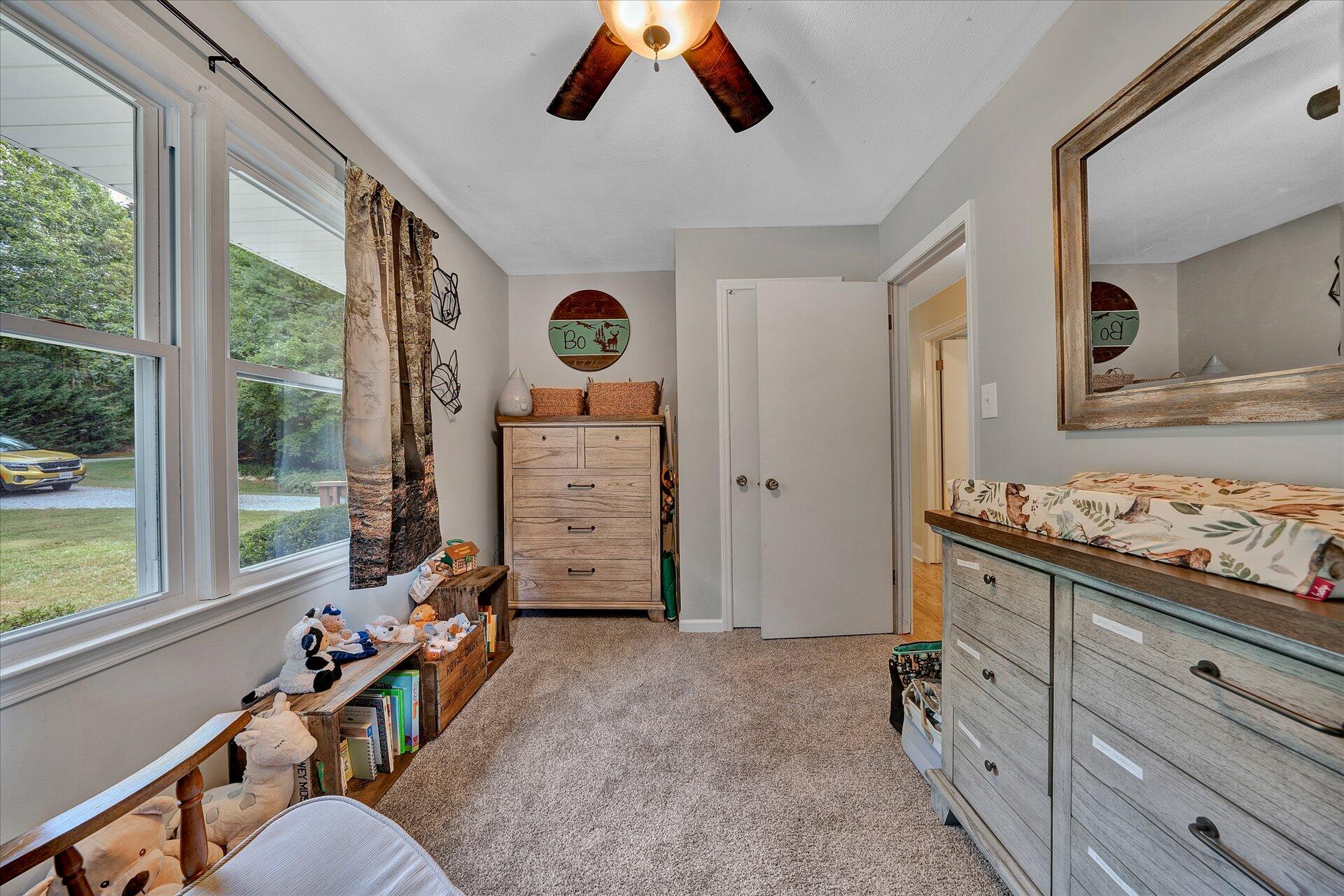 210 Sunset Ridge Road Callaway, VA 24067 - Photo 22 of 39 a bed room with a bed and a large window