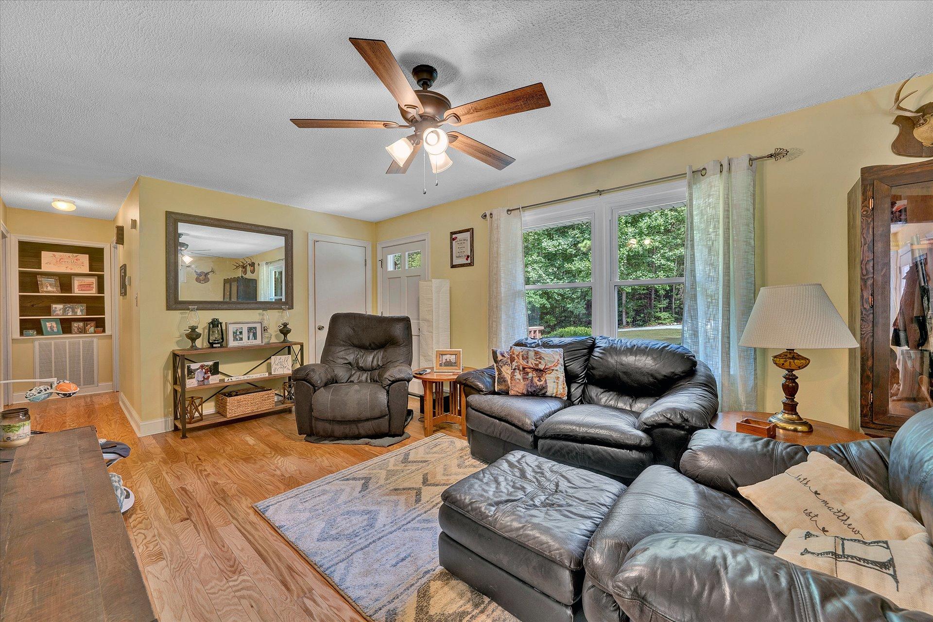 210 Sunset Ridge Road Callaway, VA 24067 - Photo 8 of 39 a living room with furniture and a large window