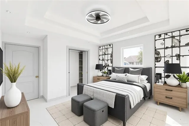 a bedroom with a bed and a large window