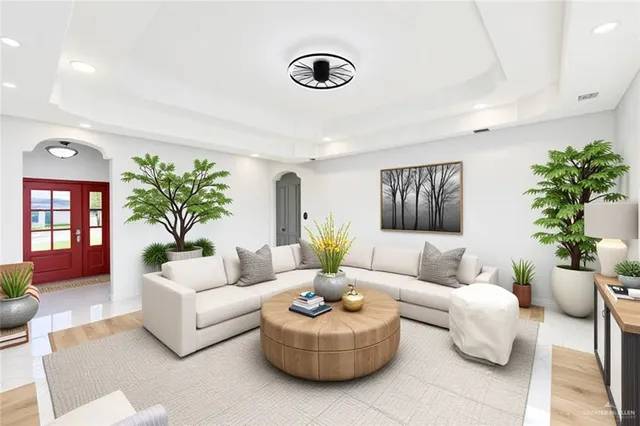 a living room with furniture and a potted plant