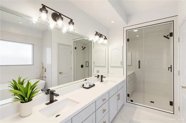 a bathroom with a sink a shower a mirror and a shower