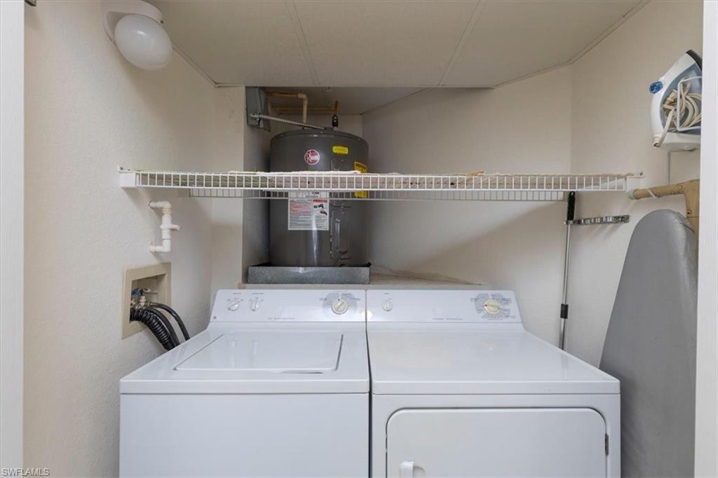 6804 Satinleaf Road South, Unit 102 Naples, FL 34109 - Photo 21 of 35 a utility room with dryer and washer