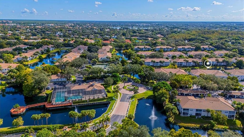 6804 Satinleaf Road South, Unit 102 Naples, FL 34109 - Photo 24 of 35 an aerial view of residential houses and outdoor space