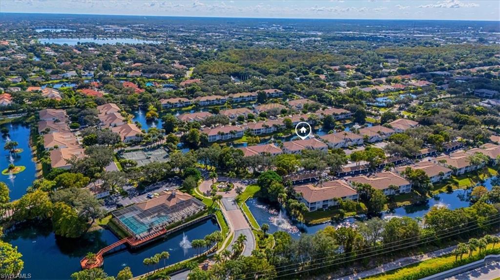6804 Satinleaf Road South, Unit 102 Naples, FL 34109 - Photo 25 of 35 an aerial view of residential houses with outdoor space and swimming pool