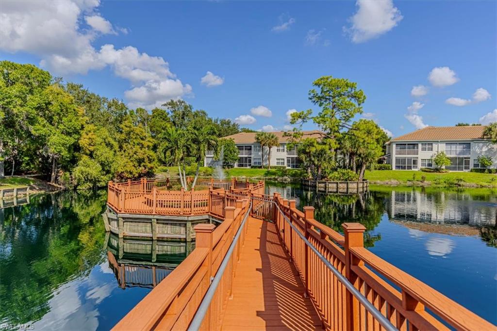 6804 Satinleaf Road South, Unit 102 Naples, FL 34109 - Photo 28 of 35 a view of a balcony with chairs