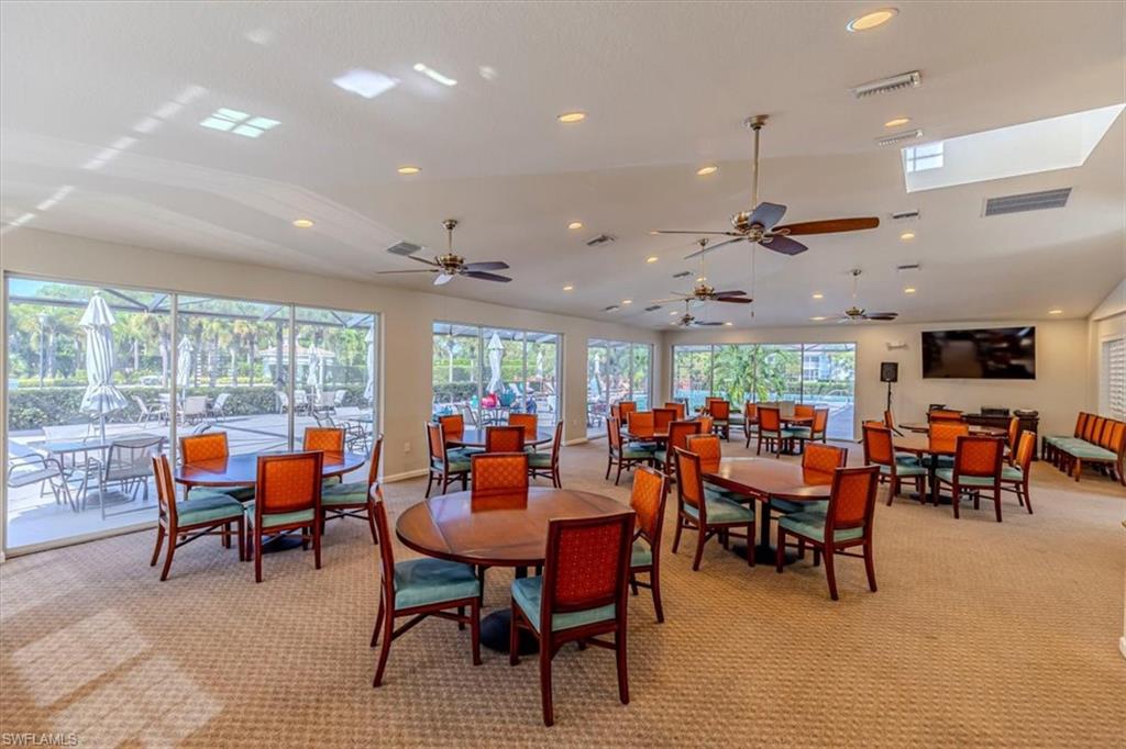 6804 Satinleaf Road South, Unit 102 Naples, FL 34109 - Photo 34 of 35 a outdoor space with furniture and lots of tables