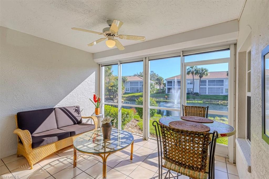 6804 Satinleaf Road South, Unit 102 Naples, FL 34109 - Photo 4 of 35 a living room with furniture and a large window