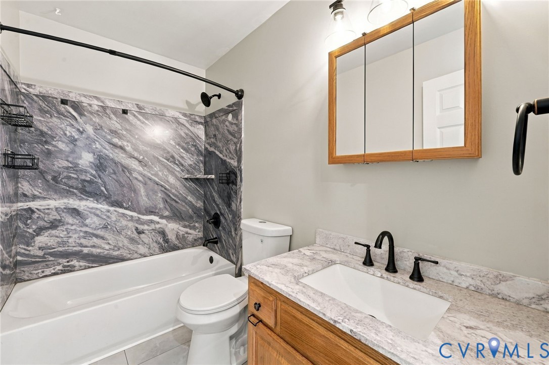 133 Ford Road Bumpass, VA 23024 - Photo 28 of 55 Bathroom featuring a bathtub with a marble-pattern