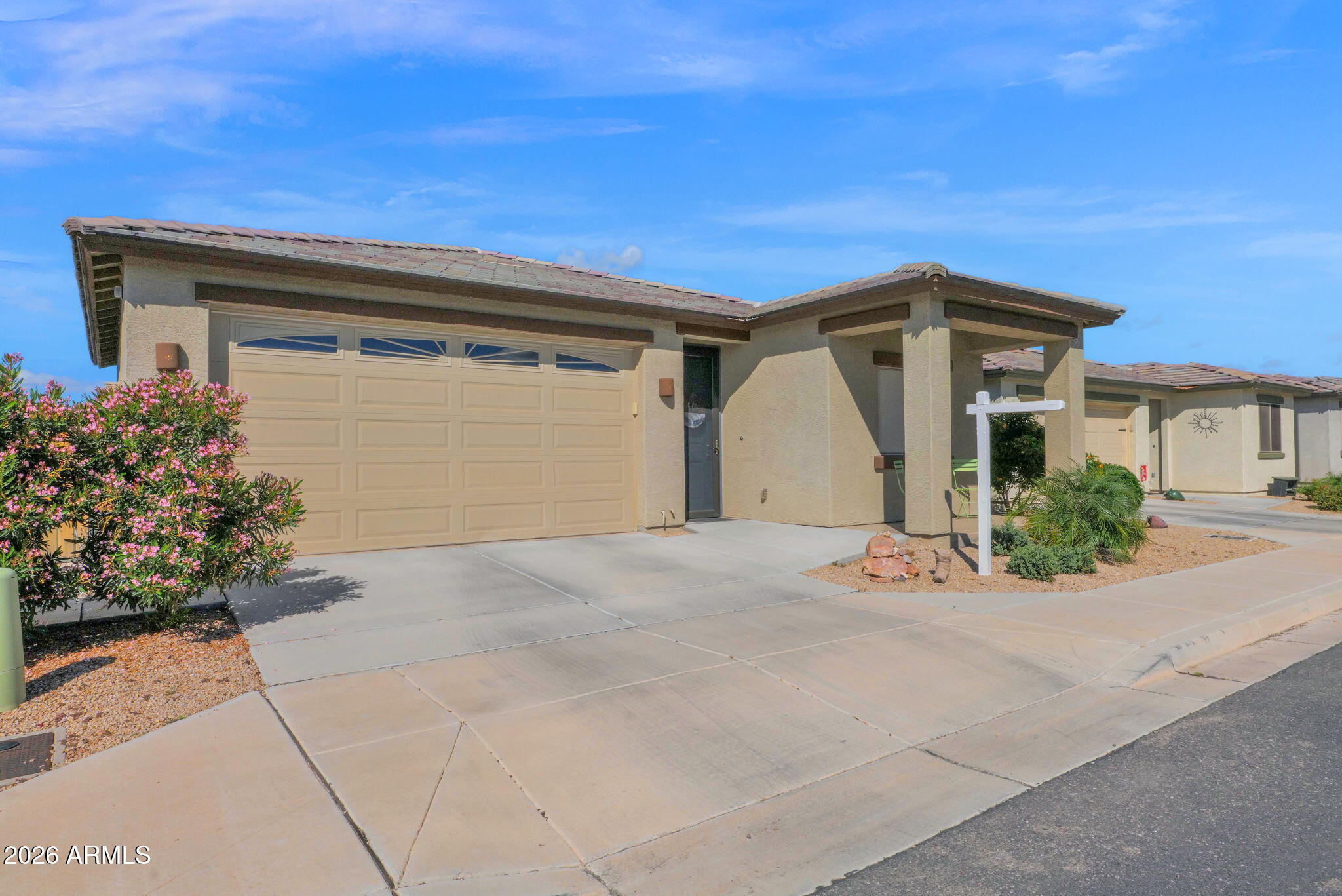 1792 South Hayley Road Apache Junction, AZ 85119 - Photo 13 of 64 a front view of a house with a yard and garage