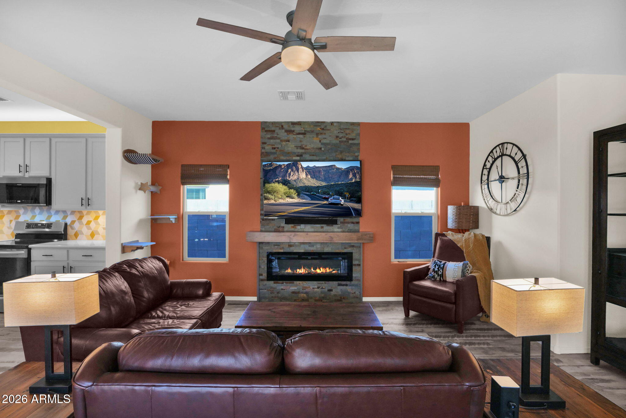1792 South Hayley Road Apache Junction, AZ 85119 - Photo 32 of 64 a living room with furniture a fireplace and a window