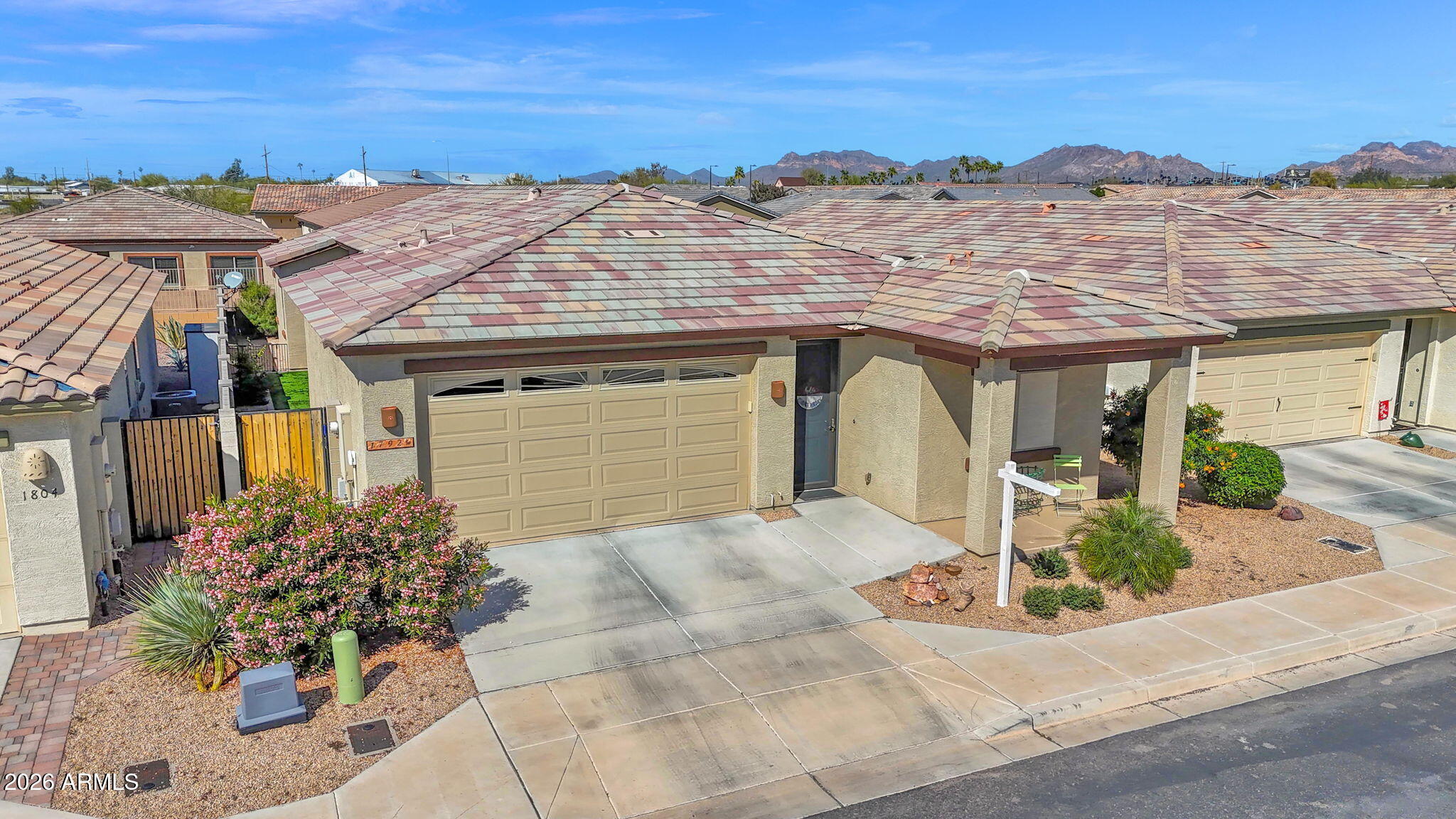 1792 South Hayley Road Apache Junction, AZ 85119 - Photo 3 of 64 a front view of a house with a yard