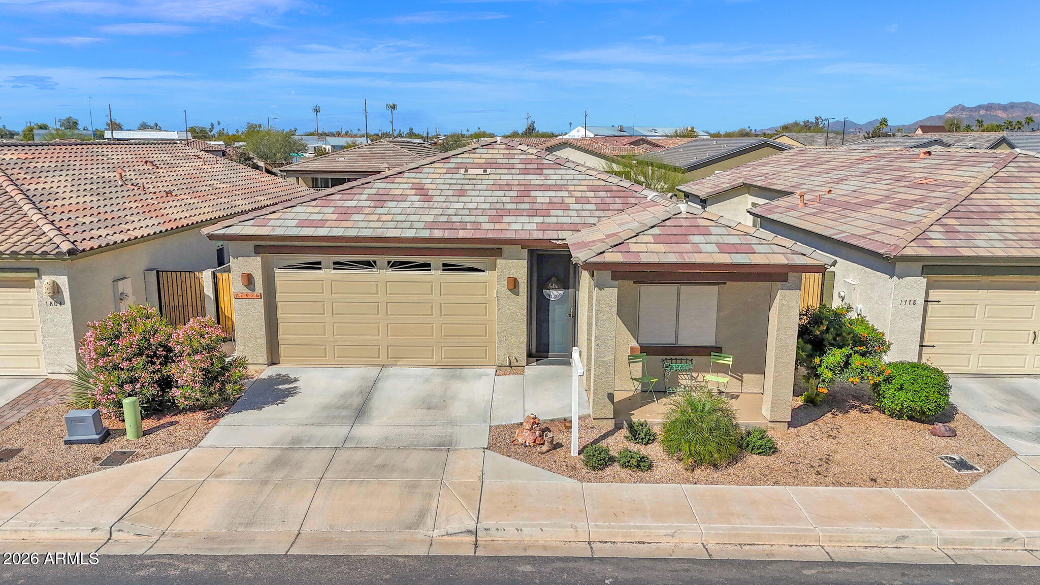 1792 South Hayley Road Apache Junction, AZ 85119 - Photo 4 of 64 a front view of a house with a garden