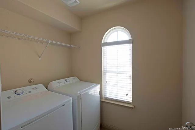 a utility room with dryer and washer