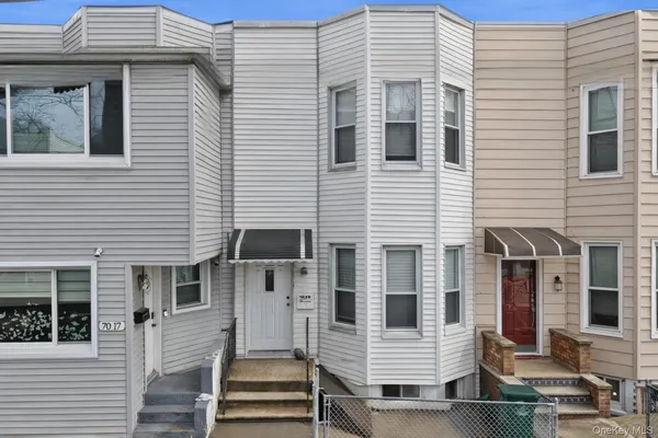 a view of a house with more windows and brick wall