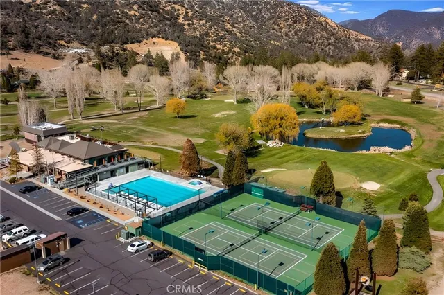 an aerial view of a houses with outdoor space