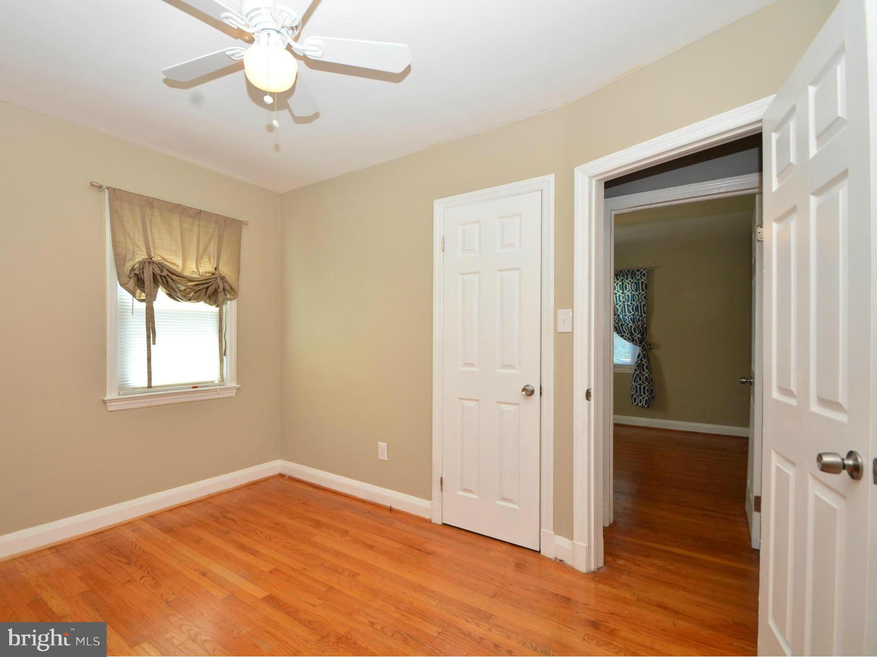 1911 Harford Road Fallston, MD 21047 - Photo 14 of 30 an empty room with wooden floor closet and windows