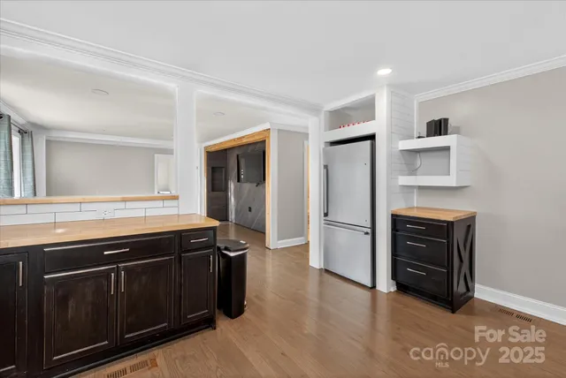 a kitchen with a stove and a refrigerator