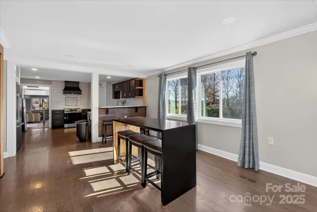 a livingroom with furniture wooden floor and windows
