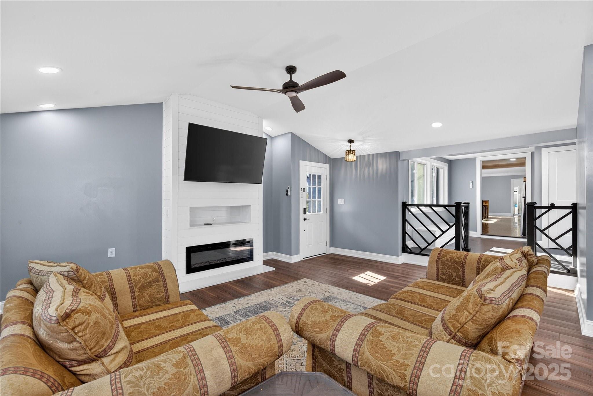 1117 Jug Broome Road Monroe, NC 28112 - Photo 2 of 38 a bedroom with a bed couch and a flat screen tv
