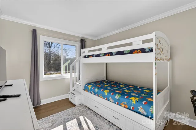 a room with toys and baby crib