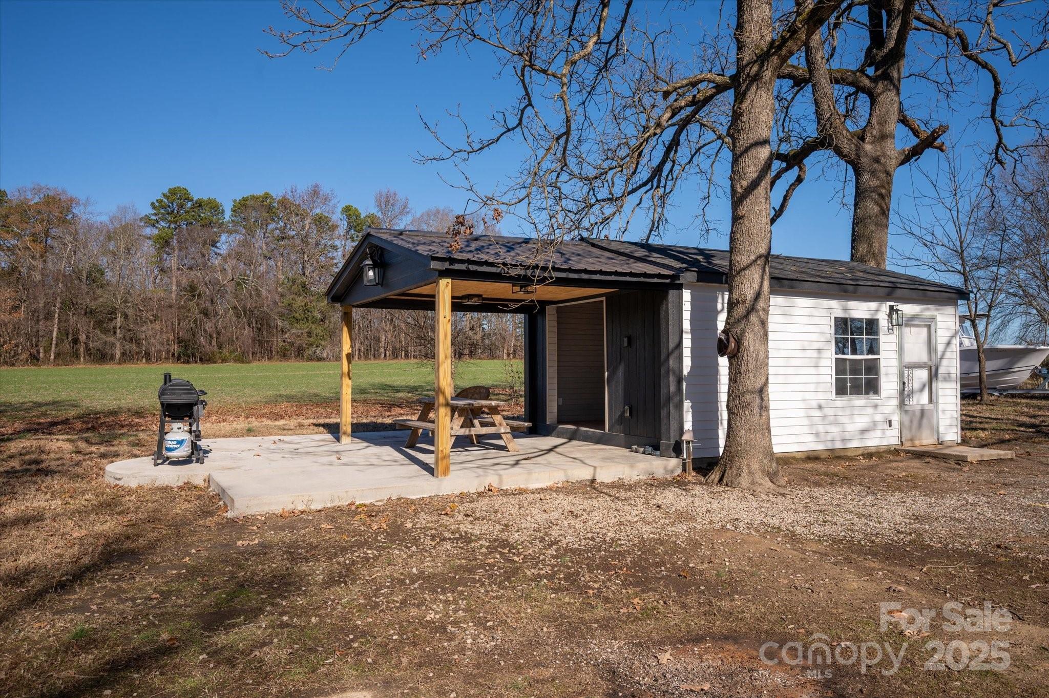 1117 Jug Broome Road Monroe, NC 28112 - Photo 29 of 38 a view of a house with backyard porch and sitting area