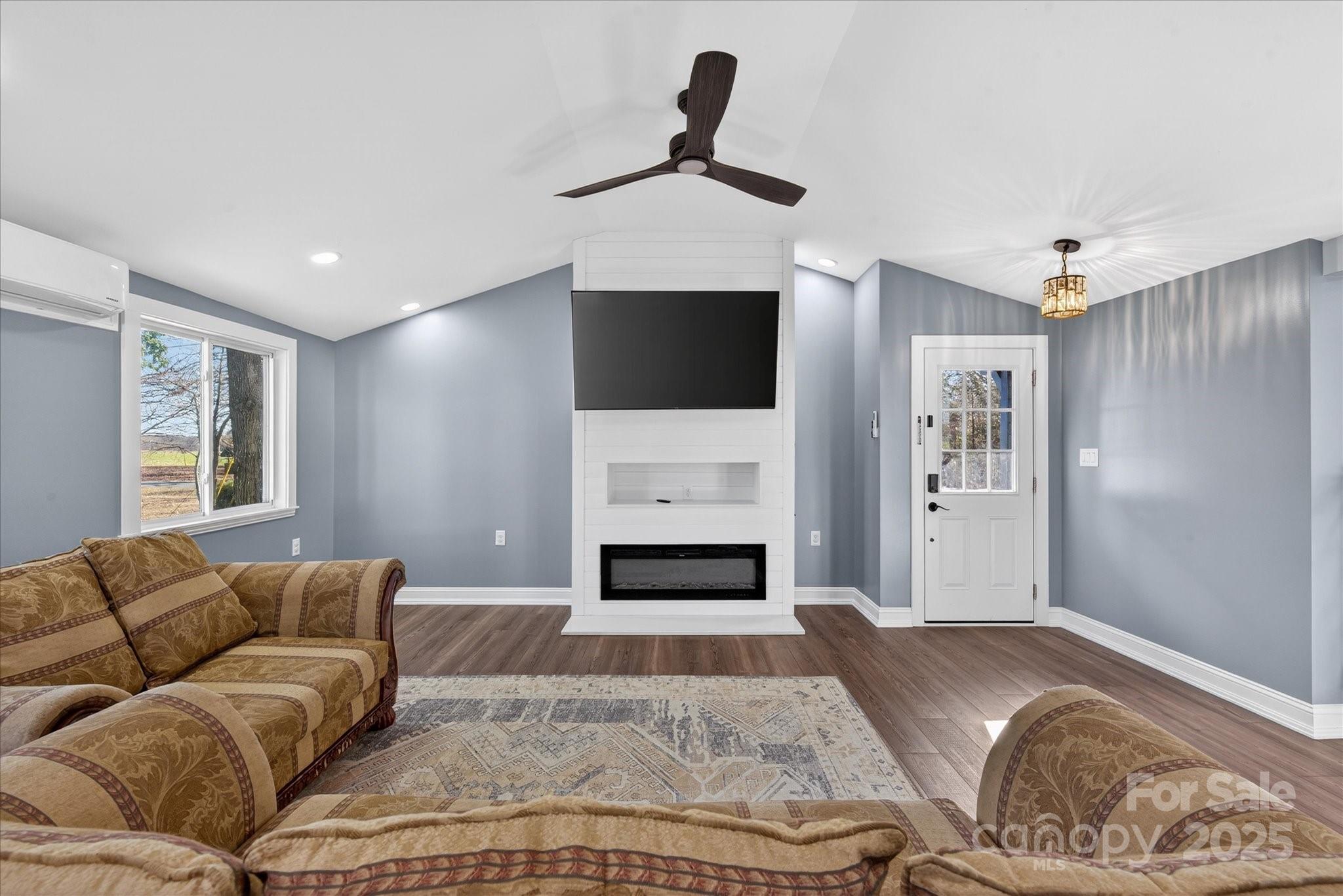 1117 Jug Broome Road Monroe, NC 28112 - Photo 3 of 38 a living room with furniture and a fireplace