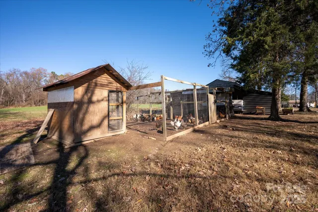 a view of house with outdoor space and sitting area