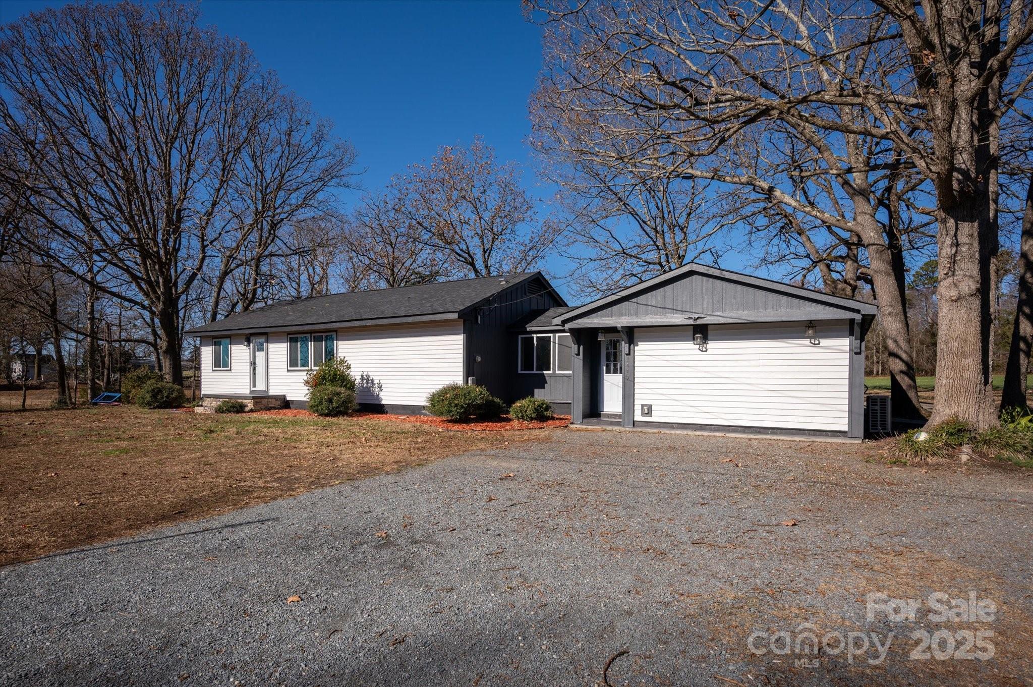 1117 Jug Broome Road Monroe, NC 28112 - Photo 38 of 38 a view of a house with a yard and garage