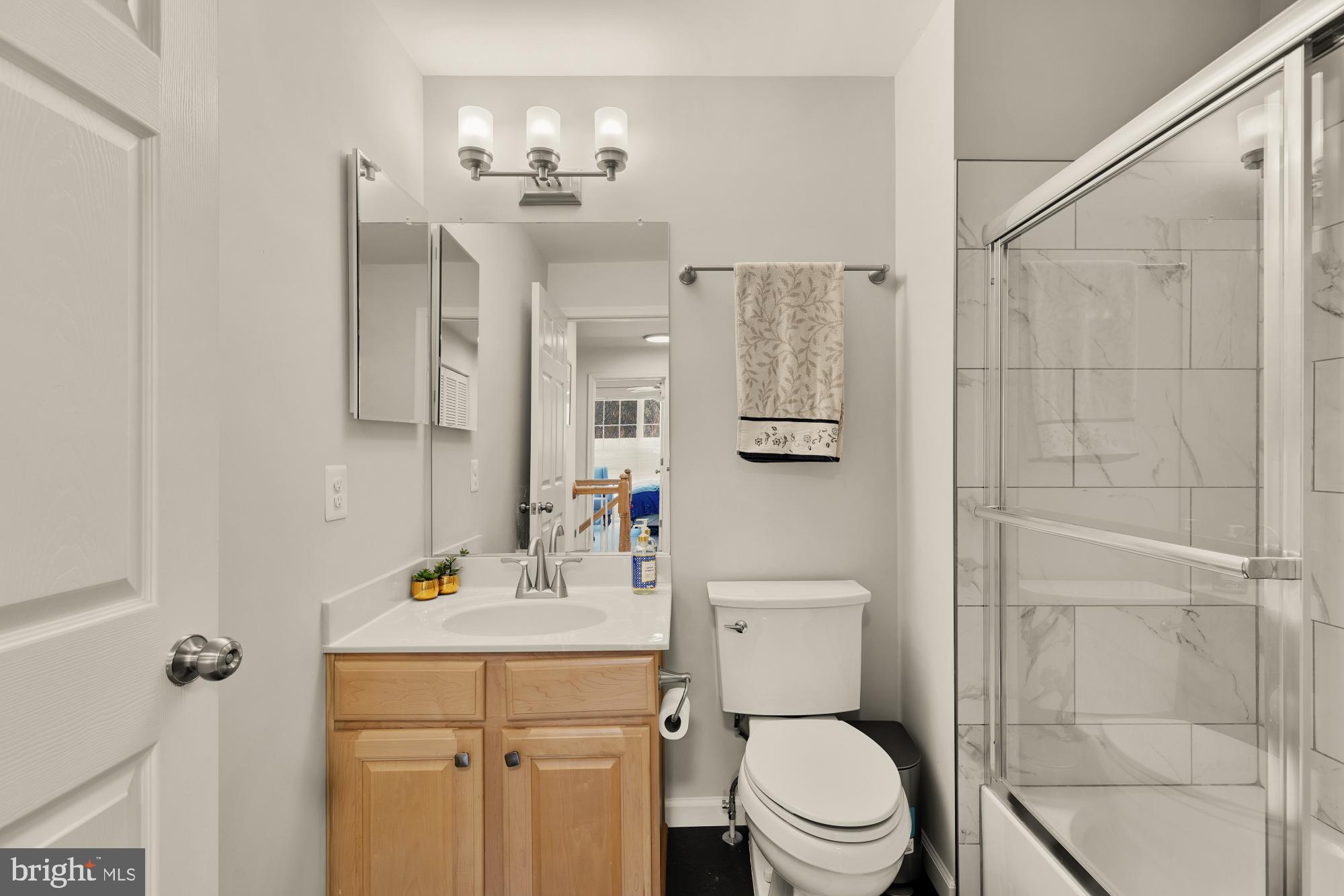 1887 Crescent Park Drive, Unit 111A Reston, VA 20190 - Photo 15 of 27 a bathroom with a sink toilet and shower