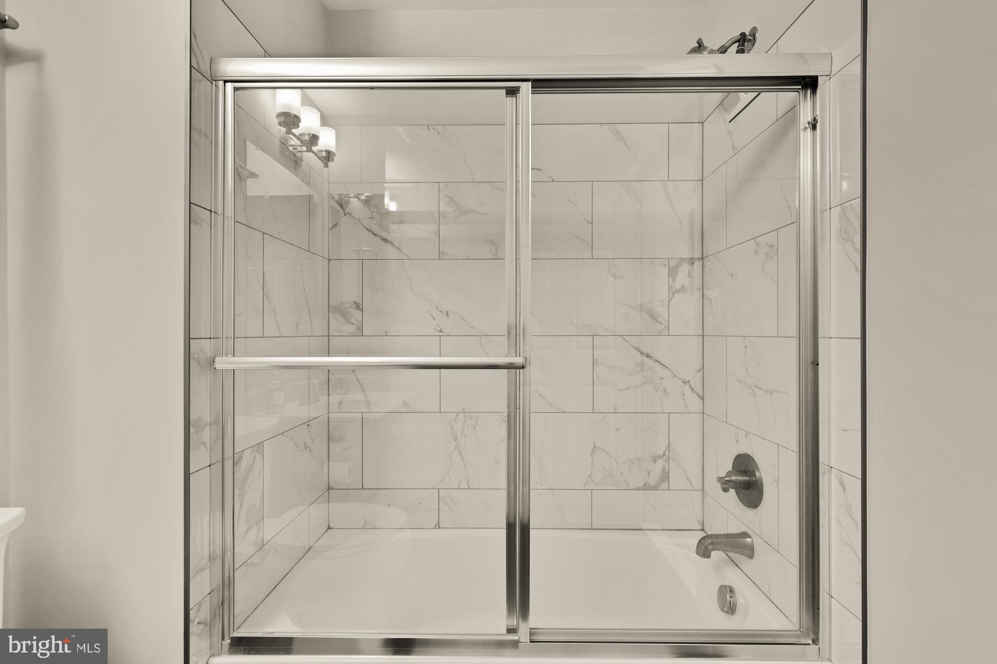 1887 Crescent Park Drive, Unit 111A Reston, VA 20190 - Photo 17 of 27 a bathroom with a shower