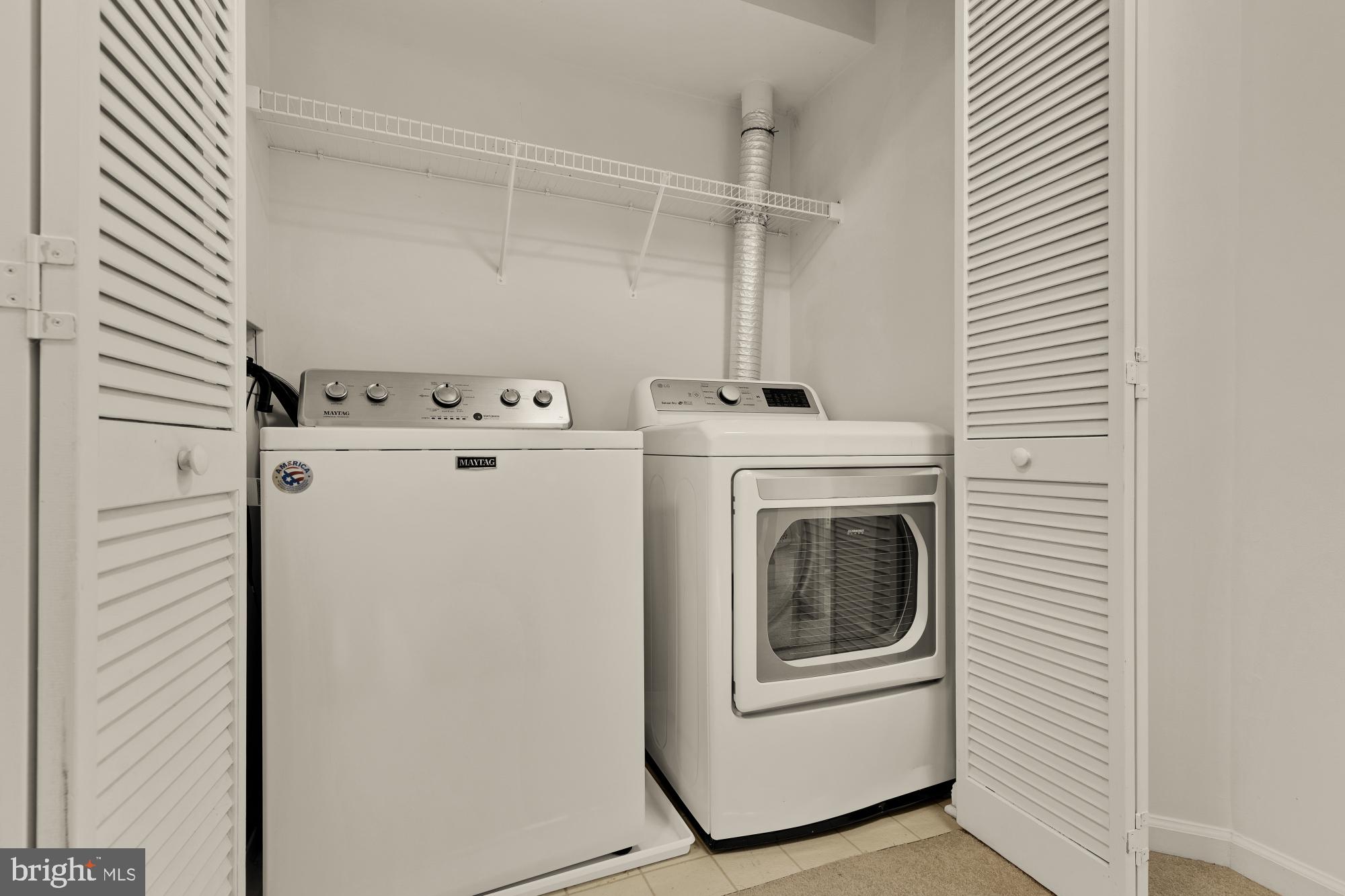 1887 Crescent Park Drive, Unit 111A Reston, VA 20190 - Photo 18 of 27 a utility room with dryer and washer