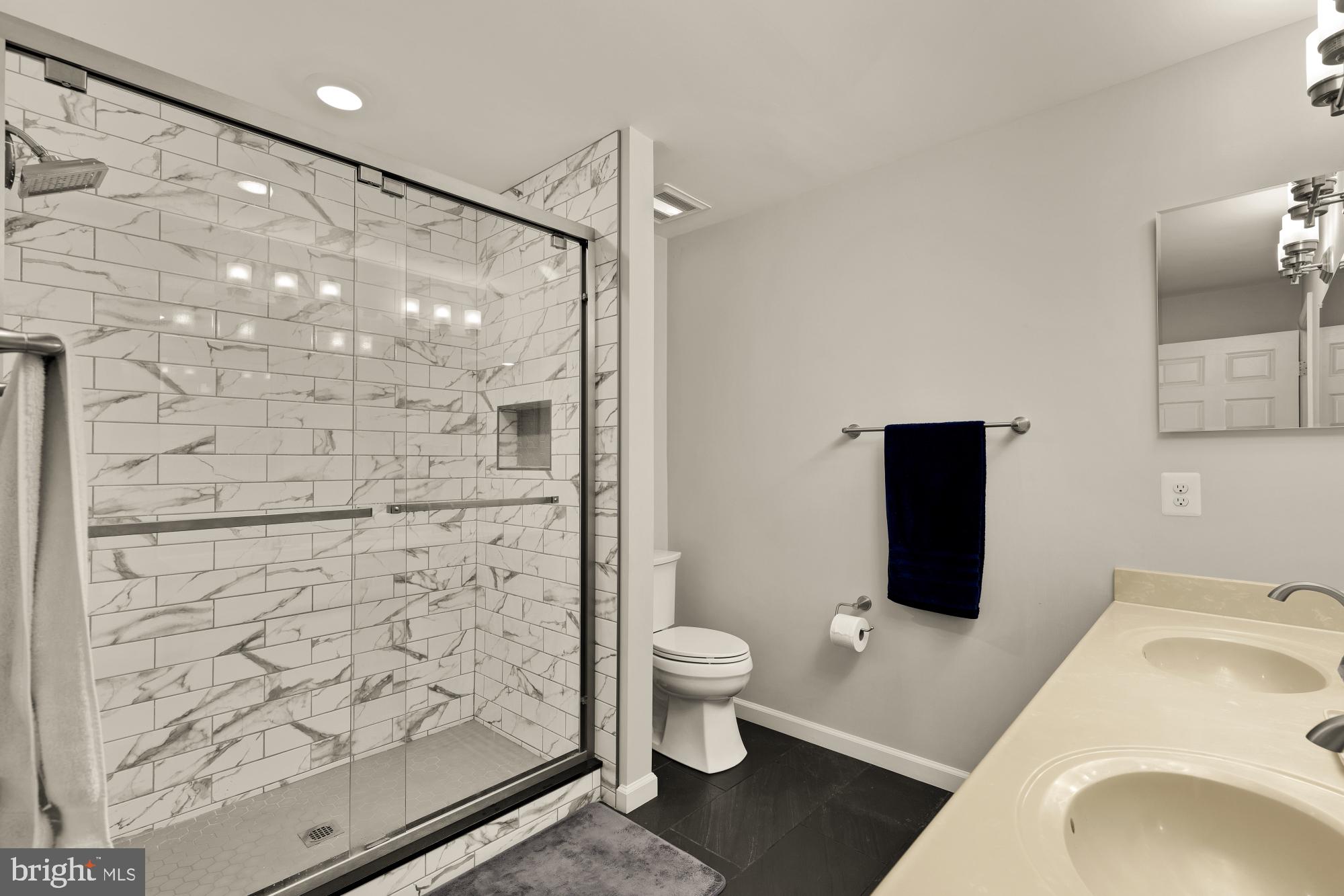1887 Crescent Park Drive, Unit 111A Reston, VA 20190 - Photo 21 of 27 a bathroom with a sink a toilet and shower