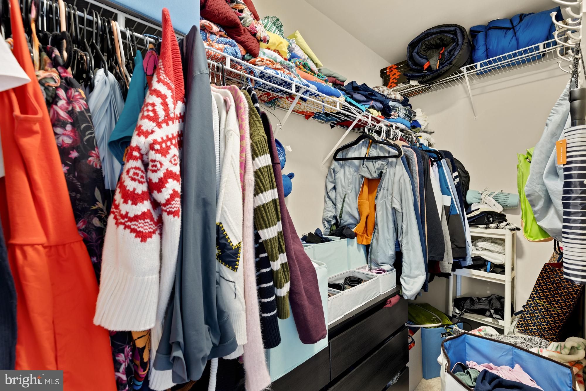 1887 Crescent Park Drive, Unit 111A Reston, VA 20190 - Photo 25 of 27 a view of walk in closet with clothes and shoes
