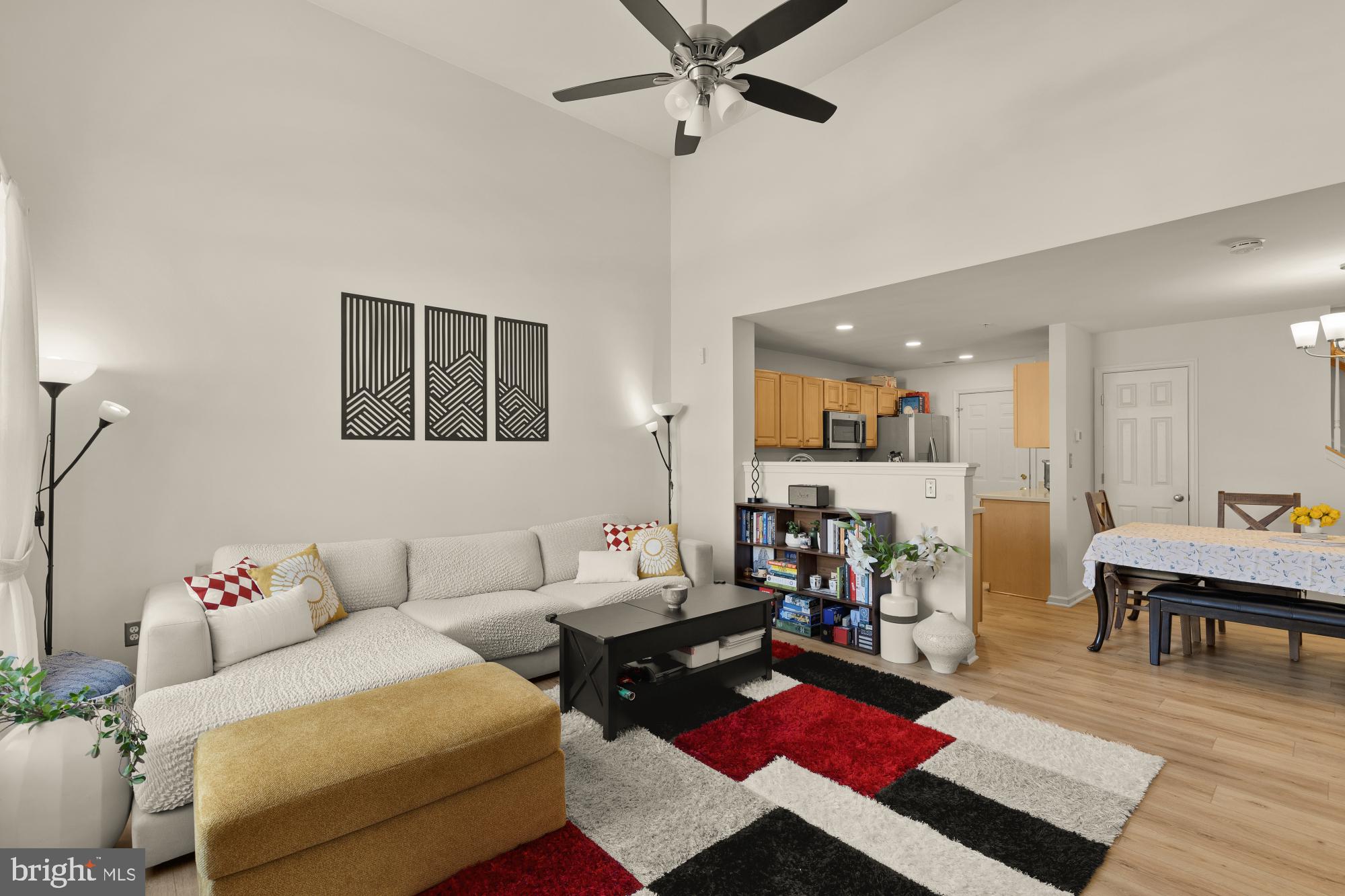 1887 Crescent Park Drive, Unit 111A Reston, VA 20190 - Photo 3 of 27 a living room with furniture and wooden floor