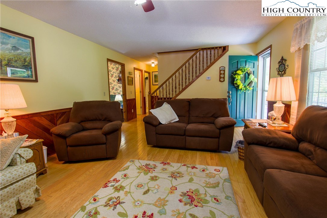 581 North Fork New River Road Lansing, NC 28643 - Photo 12 of 44 a living room with furniture and a couch