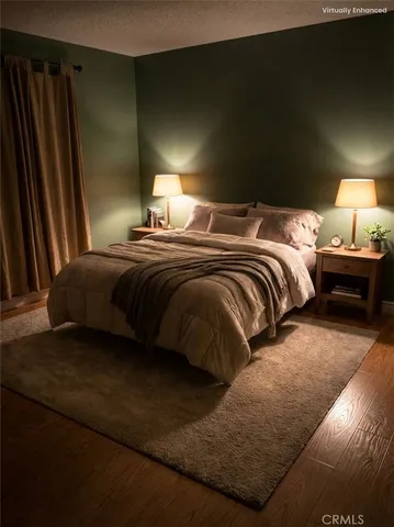 a bedroom with a bed and a mirror