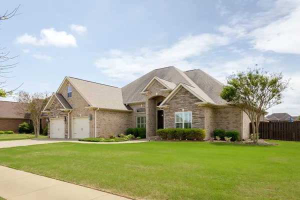 a front view of house with yard and green space