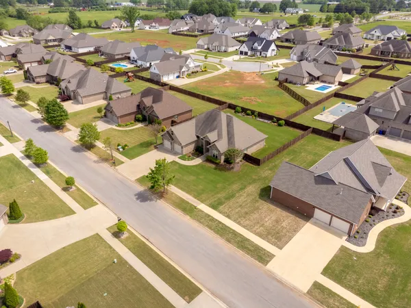 an aerial view of residential houses with outdoor space