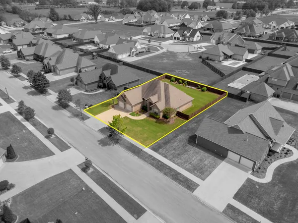 an aerial view of residential house with outdoor space